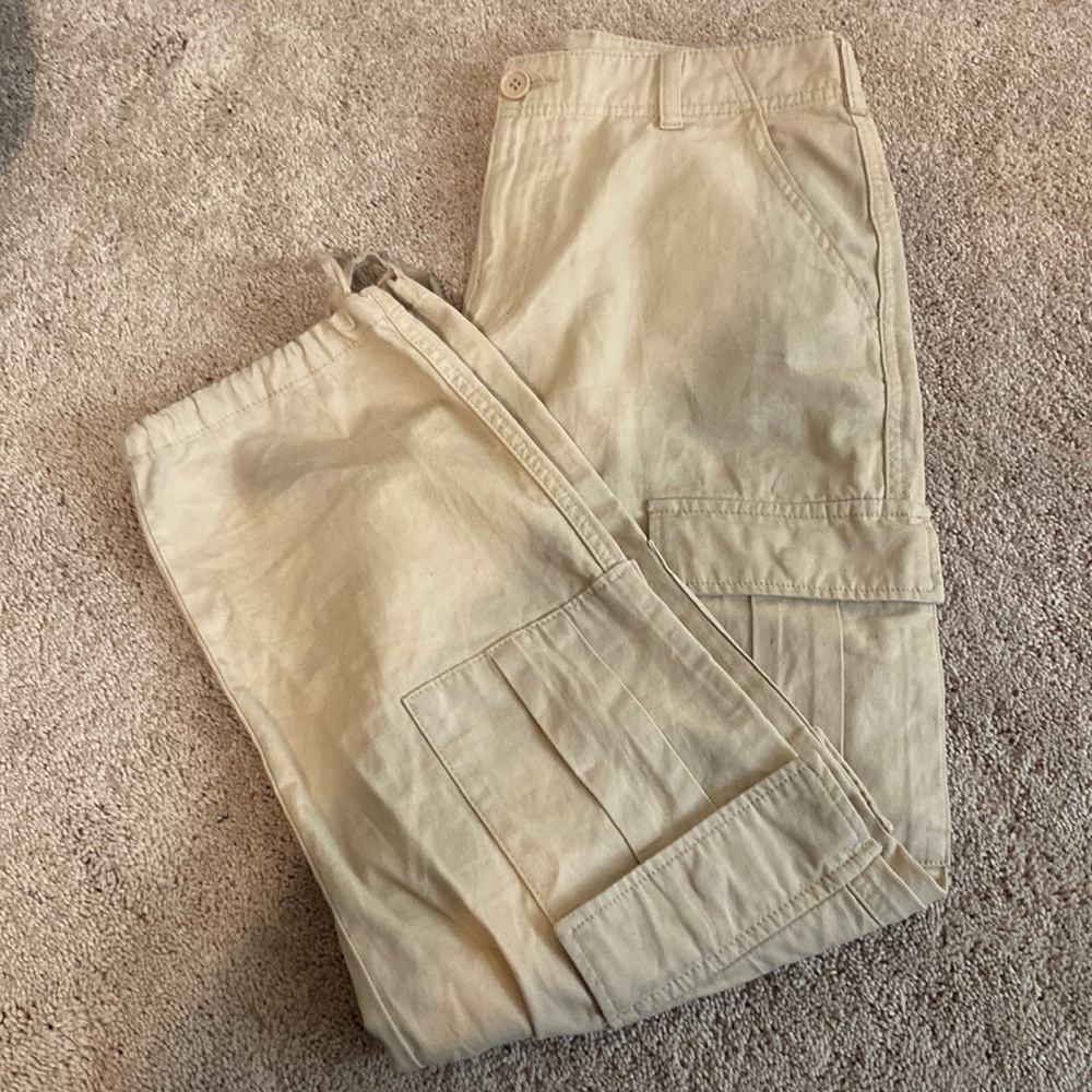 Tan F21 cargo pants with adjustable  drawstring at the bottom of the pants.